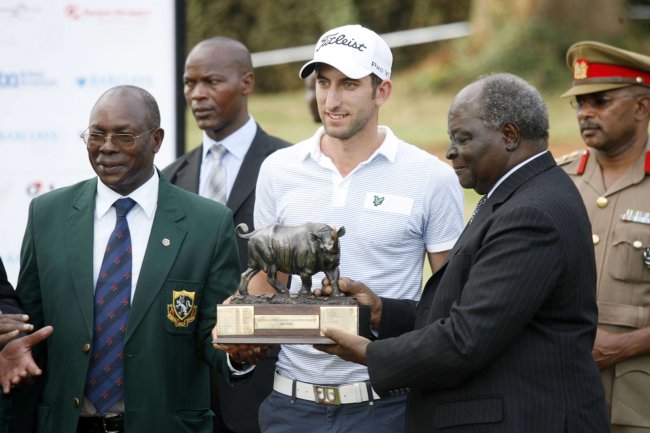 England’s Seve Benson receives his Kenya Open trophy from President Mwai Kibaki.(Photo:Shutterspeed)