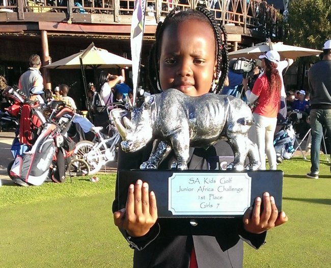 Chanelle Wangari, poses with her trophy after winning the girls under 7 category at the Africa junior championships in South Africa.
