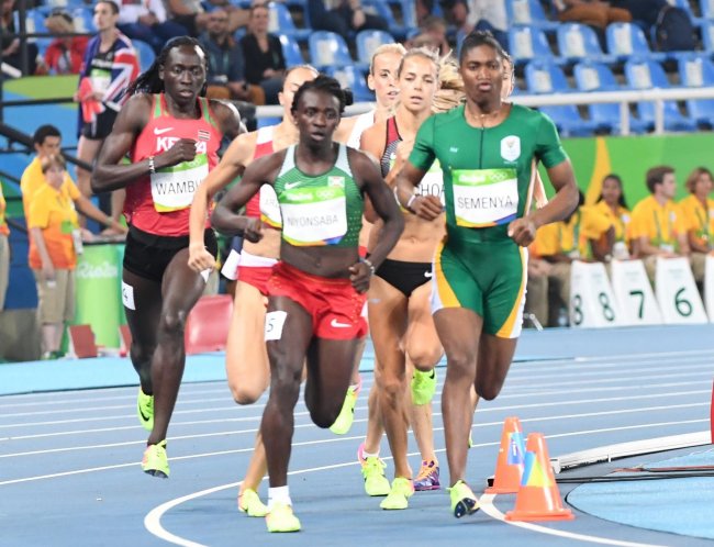 Margaret Nyairera(in red top) Francine Niyonsaba(in red and green) with Caster Semenya(in green) in the women's 800m final.(Photo by Norman Katende)