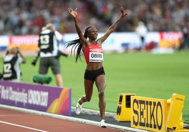 Hellen Obiri crosses the finish line to win gold in the Women's 5000 metres final during day ten of the 16th IAAF World Athletics Championships. (Getty Images for IAAF)