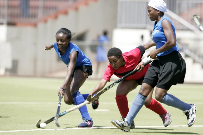 Faith Wanga of the University of Nairobi steals the ball from JKUAT's Joy Mumbe supported by Velma Ager. JKUAT won 1-0. (Photo by Shutterspeed)