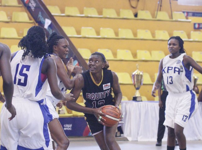  Mercy Wanyama (center) attempts to duck the KPA defense. She was also named Best Power Forward of the Tournament. (Photo Courtesy)