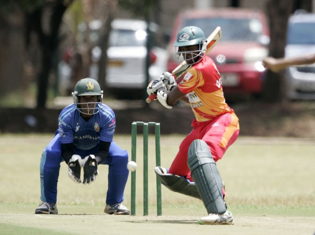 Collins Obuya of Stray Lions plays a shot with Swamibapa Wicketkeeper Maurice Ouma keeping a close watch. He scored  62 including two sixes and a four.  (Photo by Shutterspeed)