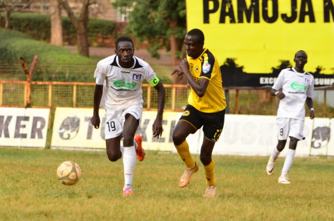 Muhoroni Youth's Faina Jacobs attempts to wheel away from Tusker FC's Lloyd Wahome. (Photo Courtesy)