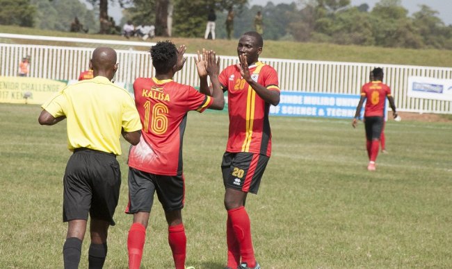 Hood Kaweesa and Milton Kalisa celebrate one of the five Uganda Cranes goals. (Photo Courtesy